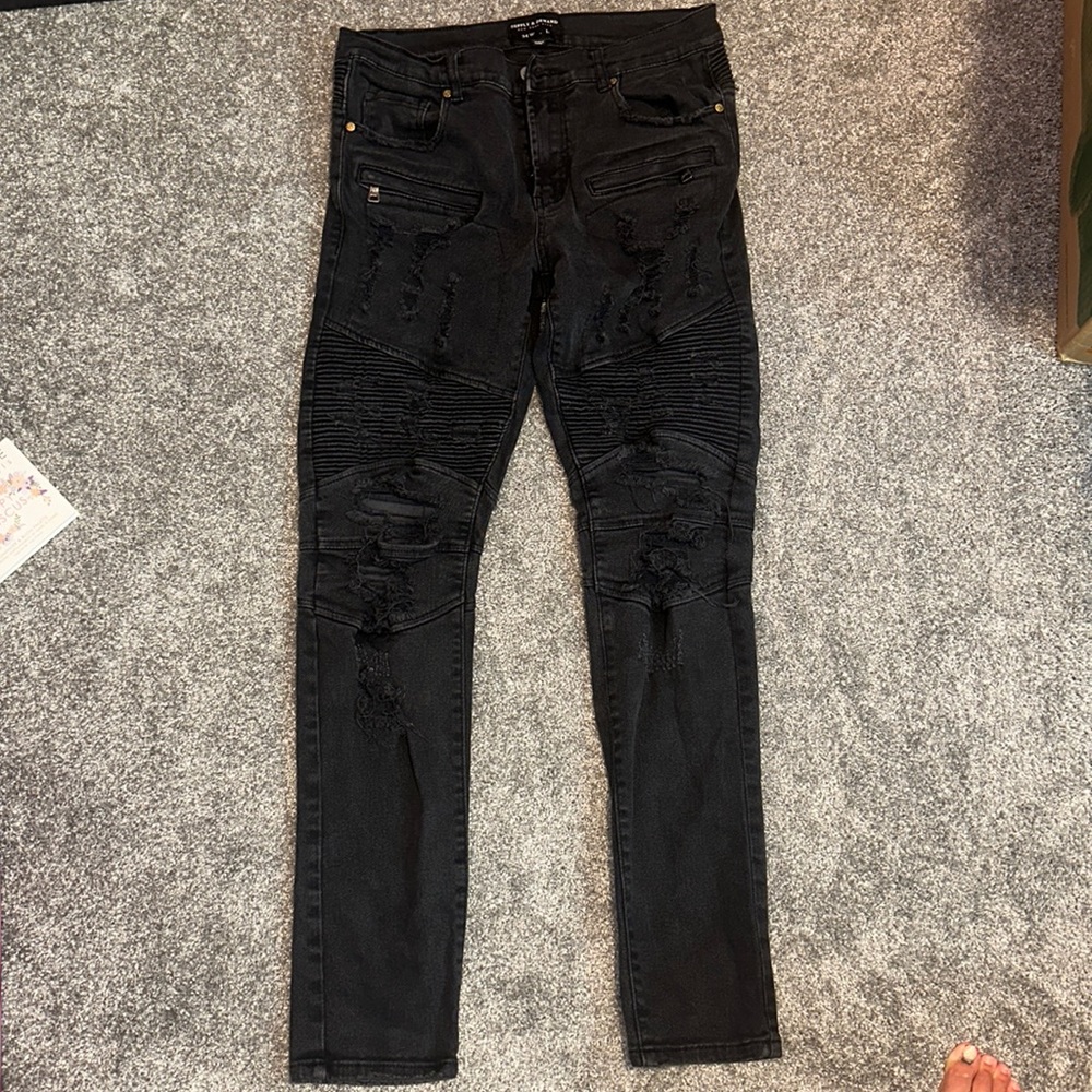 Men’s black ripped jeans by supply & demand